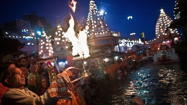 A Hindu priest performs the morning Ganga Arti Puja before sunrise on the banks of the Ganges river in Haridwar. (Representative Image) (Daniel Berehulak/Getty Images)