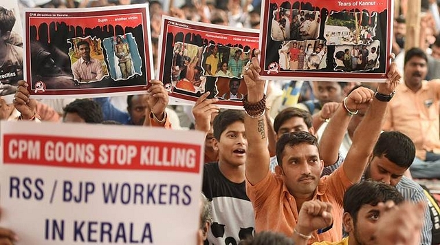 Members from the  forum against communist terror protesting against left-wing terror. (PTI)