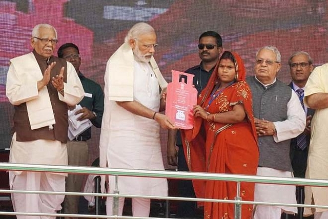 Prime Minister Narendra Modi distributing gas connections in Uttar Pradesh. (PTI)