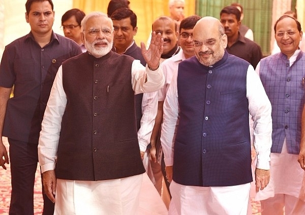 Prime Minister Narendra Modi and BJP president Amit Shah arrive at the party headquarters in New Delhi. (Raj K Raj/Hindustan Times via Getty Images)