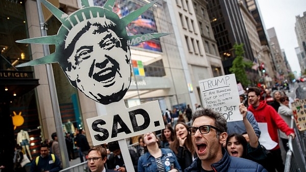 Protestors rally against President Donald Trump and his policies down the street from Trump Tower in New York City. (Drew Angerer/Getty Images)