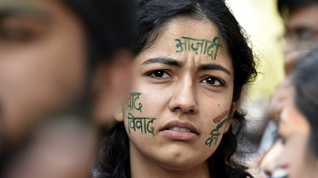  A student’s <i>azadi</i> word paint on her face during the citizens protest march in New Delhi. (Raj K Raj/Hindustan Times via Getty Images)