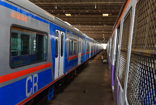 The AC local train along with a non-AC train (Satish Bate/Hindustan Times via GettyImages)