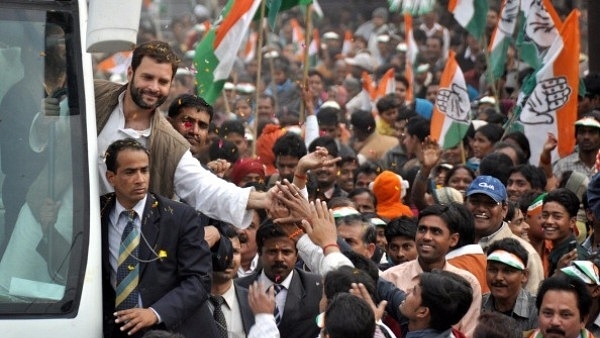 Congress president Rahul Gandhi shaking hands with people during a road show in Lucknow, in 2012, when he was the party’s general secretary. (Ashok Dutta/ Hindustan Times via Getty Images)