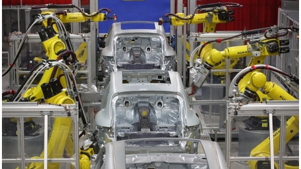 Robots weld the bodies of Porsche Macan SUVs at the new Porsche Macan factory at the Porsche plant on February 11, 2014 in Leipzig, Germany. (Sean Gallup/Getty Images)