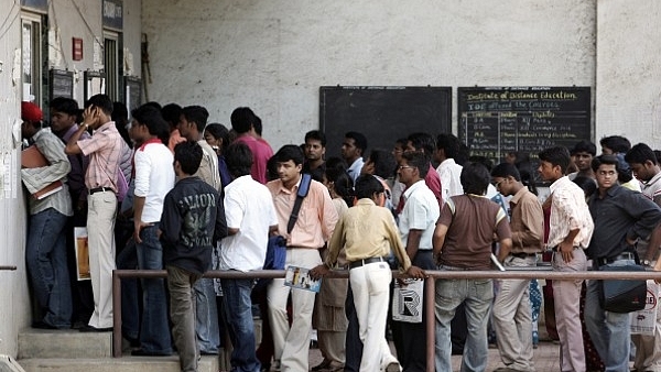 A serpentine queue of students heading to the enquiry encounter to check on various courses offered and eligibility criteria. (Manoj Patil/Hindustan Times via Getty Images)