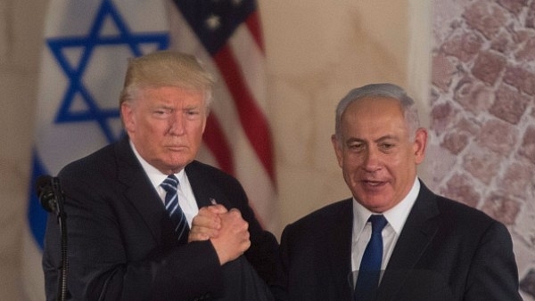 US President Donald Trump (L) and Israel’s Prime Minister Benjamin Netanyahu shake hands at the Israel Museum in Jerusalem, Israel. (Lior Mizrahi/Getty Images)