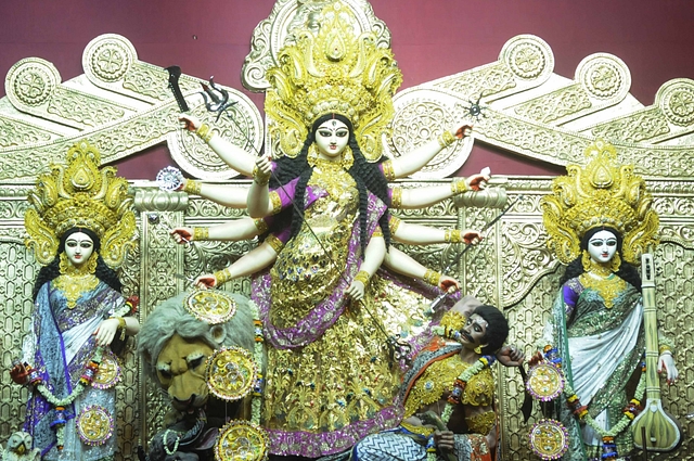 Durga Puja celebrations at Santosh Mitra Square in Kolkata, where the pandal theme is based on the Buckingham Palace of London. (Photo by Samir Jana/Hindustan Times via GettyImages)