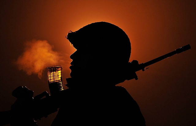 A security forces personnel patrolling the International border in Kashmir during a foggy winter night.&nbsp; (Nitin Kanotra/Hindustan Times via Getty Images)&nbsp;