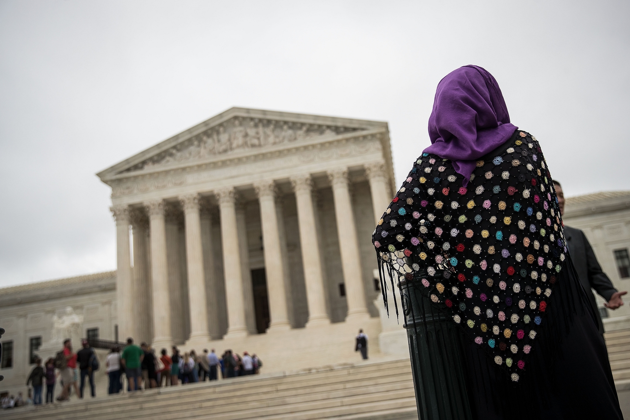 A woman wearing a hijab stands outside the U.S. Supreme Court. (Drew Angerer/Getty Images)