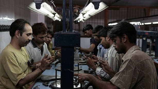 Workers busy polishing diamonds at a factory in Dahisar (Satish Bate/Hindustan Times via Getty Images)