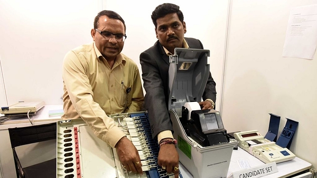  Election Commission of India officers conduct a live demonstration of the workings of the EVM and VVPAT machines ahead of announcing the schedule and process for its EVM challenge, at Vigyan Bhawan on May 20, 2017 in New Delhi (Sonu Mehta/Hindustan Times via Getty Images)