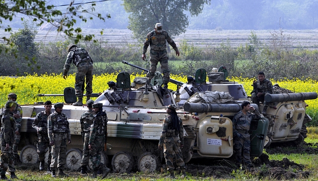 Indian army soldiers take position inside an infantry fighting vehicle.(Photo by Nitin Kanotra/Hindustan Times via Getty Images)