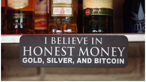 A sign announces a proprieter’s loyalty to Bitcoins, where they are also accepted for payment, at a pub on April 11, 2013 in Berlin, Germany. (Sean Gallup/Getty Images)