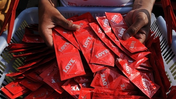  People gather to observe the International Condom Day at an event organised by Aids Healthcare Foundation (AHF) in New Delhi. (Burhaan Kinu/Hindustan Times via Getty Images)