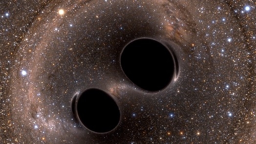 Gravitational waves being released. (Simulating eXtreme Spacetimes/ Wiki Commons)