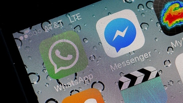 The WhatsApp application is displayed on an iPhone in 2016. (Justin Sullivan/Getty Images)