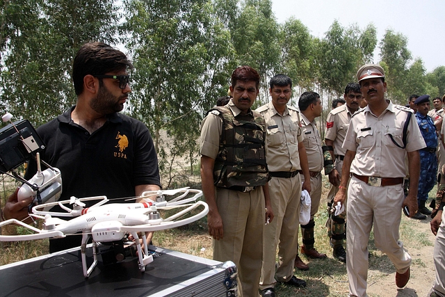 Police officers use a drone to monitor sensitive areas in Rohtak, Haryana (Manoj Dhaka/Hindustan Times via Getty Images)