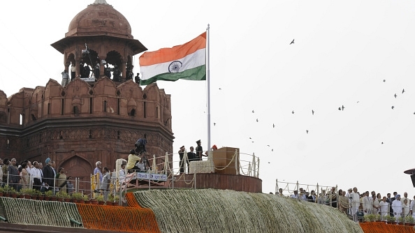 Prime Minister Narendra Modi salutes the national flag before addressing the nation on 68th Independence Day at the Red Fort on August 15, 2014 in New Delhi, India. (Mohd Zakir/Hindustan Times via Getty Images)