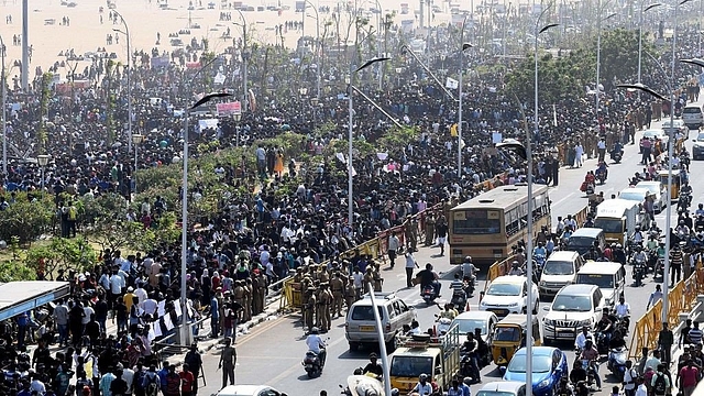 

Protesters gather during a demonstration against the ban on jallikattu and calling for a ban on animal rights orgnisation PETA, at Marina Beach in Chennai. (ARUN SANKAR/AFP/GettyImages)