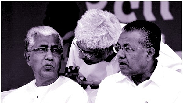 Former CPI-M general secretary Prakash Karat (C) speaks to the chief minister of Tripura, Manik Sarkar, as Kerala Chief Minister Pinarayi Vijayan looks on. (Arijit Sen/Hindustan Times via Getty Images)