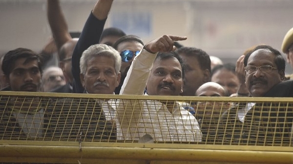 DMK leader and former union telecom minister A Raja with his supporters celebrating after the 2G case verdict. (Sonu Mehta/Hindustan Times via Getty Images)