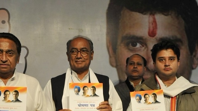 Kamal Nath (L) with Digvijaya Singh and Jyotiraditya Scindia (R). (Mujeeb faruqui/Hindustan Times via Getty Images)