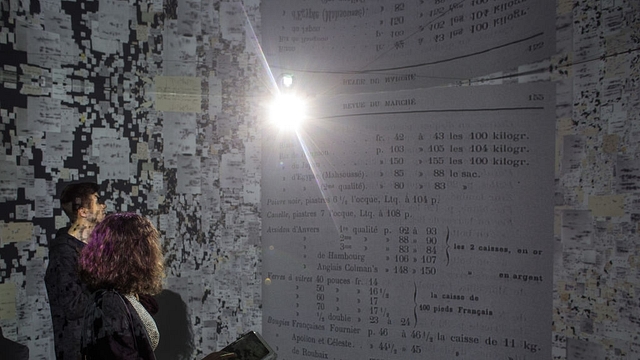 People view historical documents and photographs displayed in a high tech art installation at Salt Galata on May 6, 2017 in Istanbul, Turkey. The ‘Archive Dreaming’ installation by artist Refik Anadol uses artificial intelligence to visualize nearly 2 million historical Ottoman documents and photographs from the SALT Research Archive. (Chris McGrath/Getty Images)