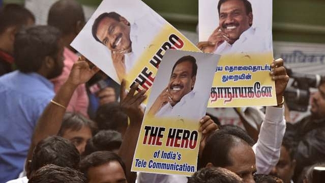 Supporters of A Raja celebrate after 2G case verdict in New Delhi. (Sonu Mehta/Hindustan Times via GettyImages) 