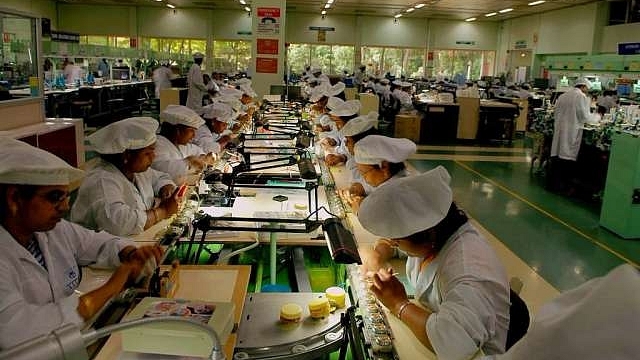 Workers at watch factory in Hosur. (Hemant Mishra/Mint via GettyImages) 