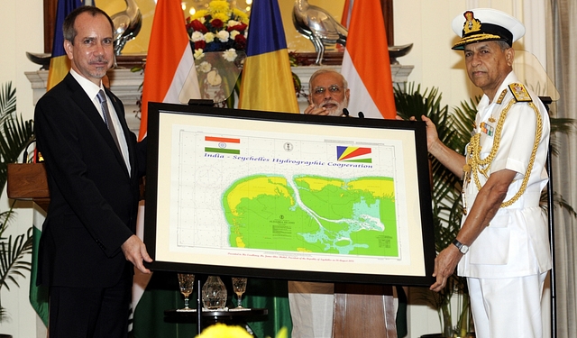 Seychelles Minister of Foreign Affairs presents a hydrographic cooperation Map to India in presence of PM Modi. (Sonu Mehta/Hindustan Times/Getty Images)