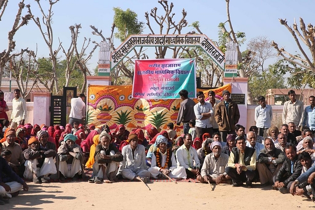 Villagers protesting the government move to privatise schools in Rajasthan. (Himanshu Vyas/Hindustan Times via Getty Images)