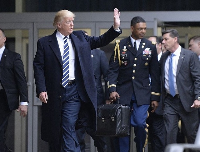 US President Donald Trump with the ‘nuclear football’ in the backdrop. (Olivier Doulier/Pool via Getty Images)