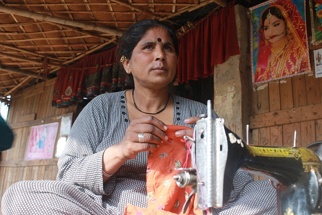 Ganga gets her sewing machine out in the sun
