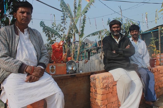 Hanuman Prasad, left, at the make shift temple at a Rohini camp.&nbsp;