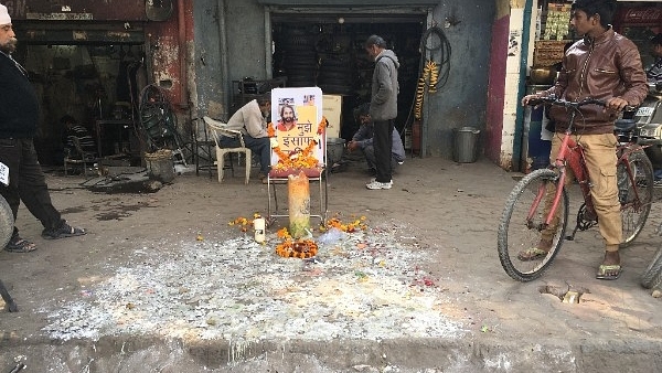 A candle march was held a week after Ankit Saxena was killed at the market junction