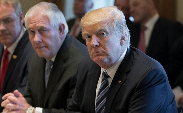 US President Donald Trump with Secretary of State Rex Tillerson(L). (Michael Reynolds-Pool via Getty Images)