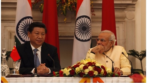 Chinese President Xi Jinping (L) and Prime Minister Narendra Modi (Arvind Yadav/Hindustan Times via Getty Images)