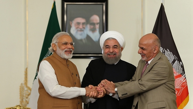 President Ghani, Prime Minister Modi and President Rouhani (C) shake hands in Tehran (Pool/ Iran Presidency/Anadolu Agency/Getty Images)