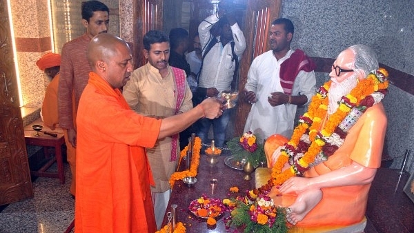 Chief Minister of Uttar Pradesh and Mahant of Gorakhdham Temple Yogi Adityanath performing puja of Brammhlin Guru Awaidhnath at Gorakhnath Temple (Deepak Gupta/Hindustan Times via GettyImages)