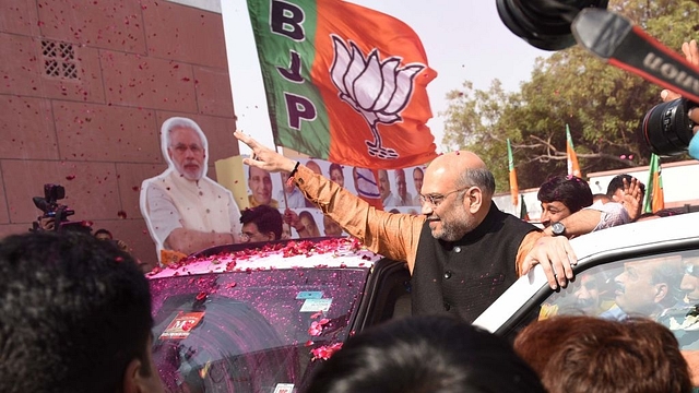 BJP Chief Amit Shah celebrates their lead in North Eastern States Elections at BJP Headquarters, DDU Marg, on March 03, 2018 in New Delhi (Sanchit Khanna/Hindustan Times via Getty Images)