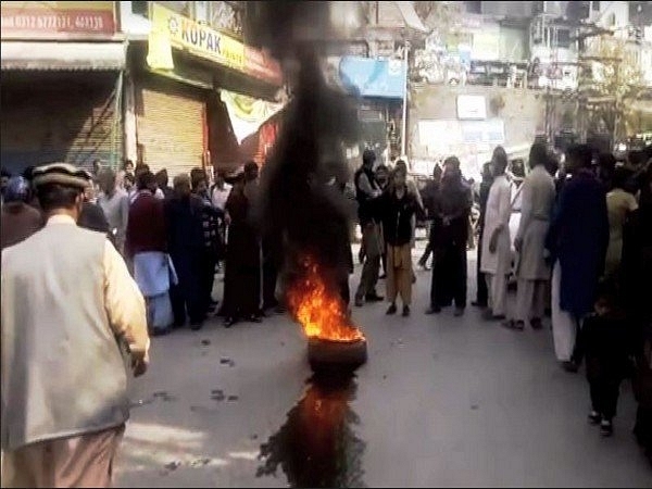 Residents protesting in Pakistan-occupied Kashmir (ANI/Twitter)