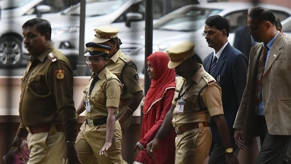 The 24-year-old Hadiya alias Akhila (in red dress) at the Supreme Court after hearing  in New Delhi. (Vipin Kumar/Hindustan Times via Getty Images)