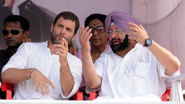 Congress President Rahul Gandhi with Chief Minister of Punjab Capt. Amarinder Singh during a rally. (Bharat Bhushan/Hindustan Times via Getty Images)