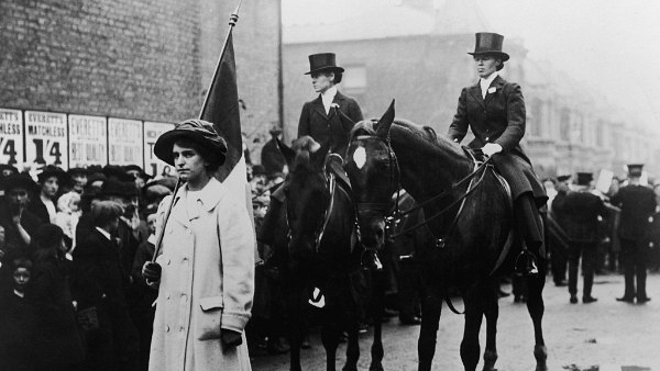 A flag carrier and two mounted marshals (riding astride) in a suffragette march through London in support of the Women’s Suffrage Bill, June 1910. (Hulton Archive/Getty Images)