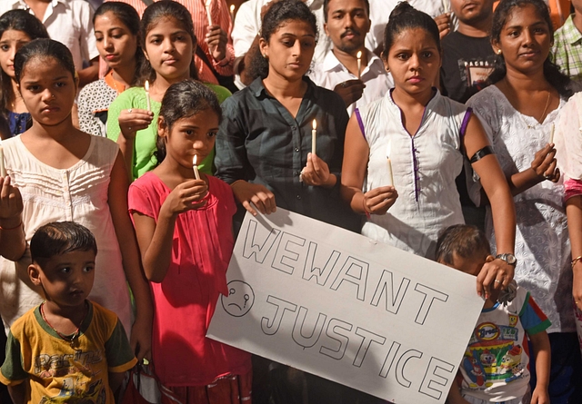 People participate in a candle protest at Parel for Kopardi rape and murder case. (Satyabrata Tripathy/Hindustan Times via Getty Images)