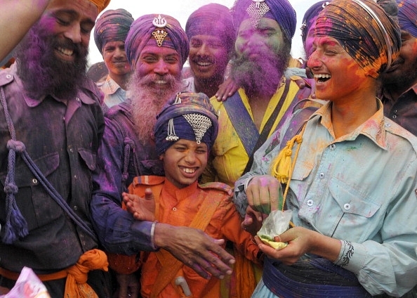 Young Nihangs playing colours during Holla Mohalla celebrations in Anandpur Sahib. (Sanjeev Sharma/Hindustan Times via Getty Images)
