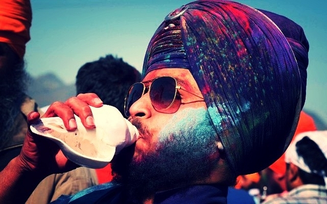 Nihangs apply colours on each other’s faces during the Hola Mohalla festival to pay their obeisance at various <i>gurudwaras</i> in Anandpur Sahib. (Sanjeev Sharma/Hindustan Times via Getty Images)