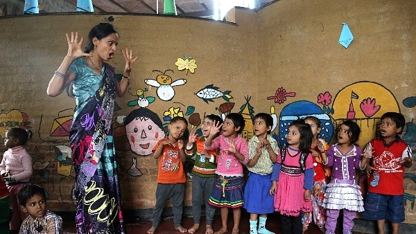 A teacher leads a lesson at Katha Community School in Govindpuri slum district of Delhi. (Chris Jackson/Getty Images)