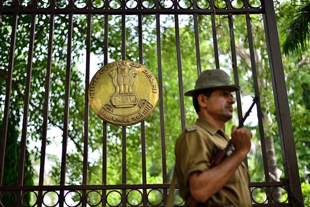 A guard outside the High Court of Delhi (Pradeep Gaur/Mint via Getty Images)